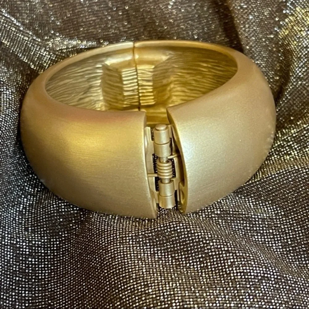 Kenneth Jay Lane satin gold bangle hinged domed